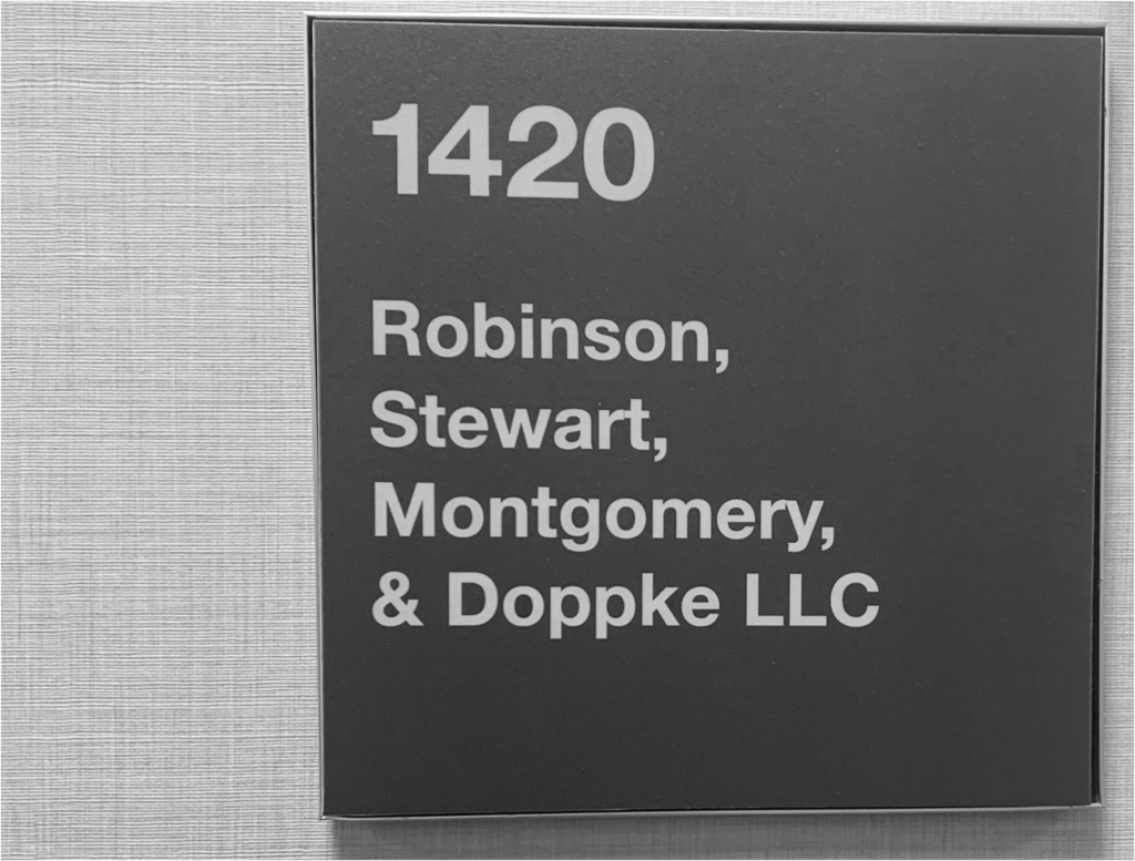 Sign reading Robinson Stewart Montgomery and Doppke